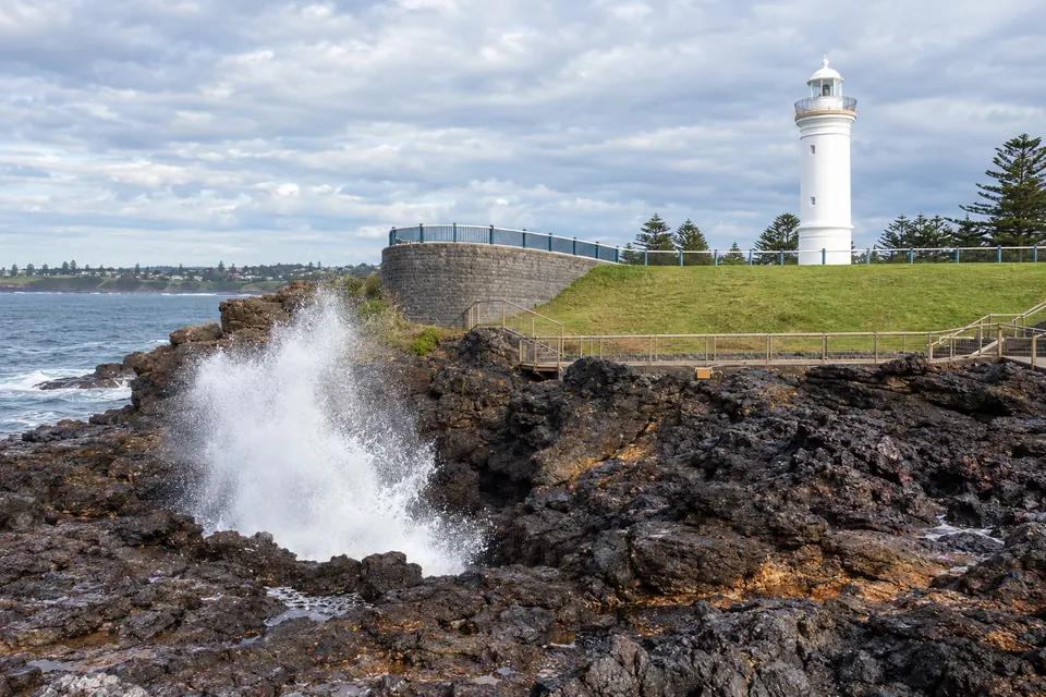Kiama Blowhole erupting beside the lighthouse