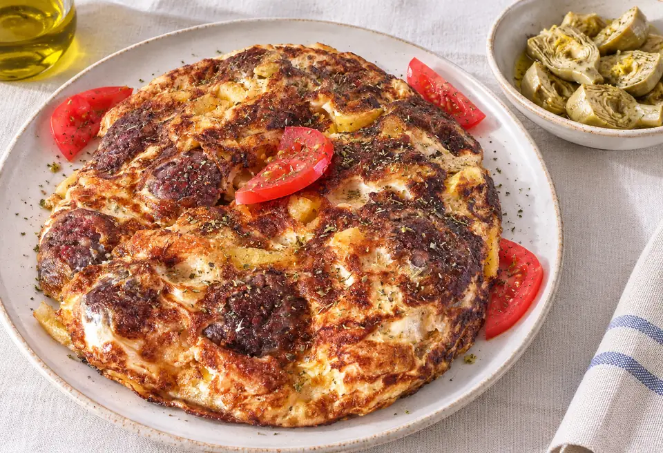 Froutalia, with wild artichokes and local sausage