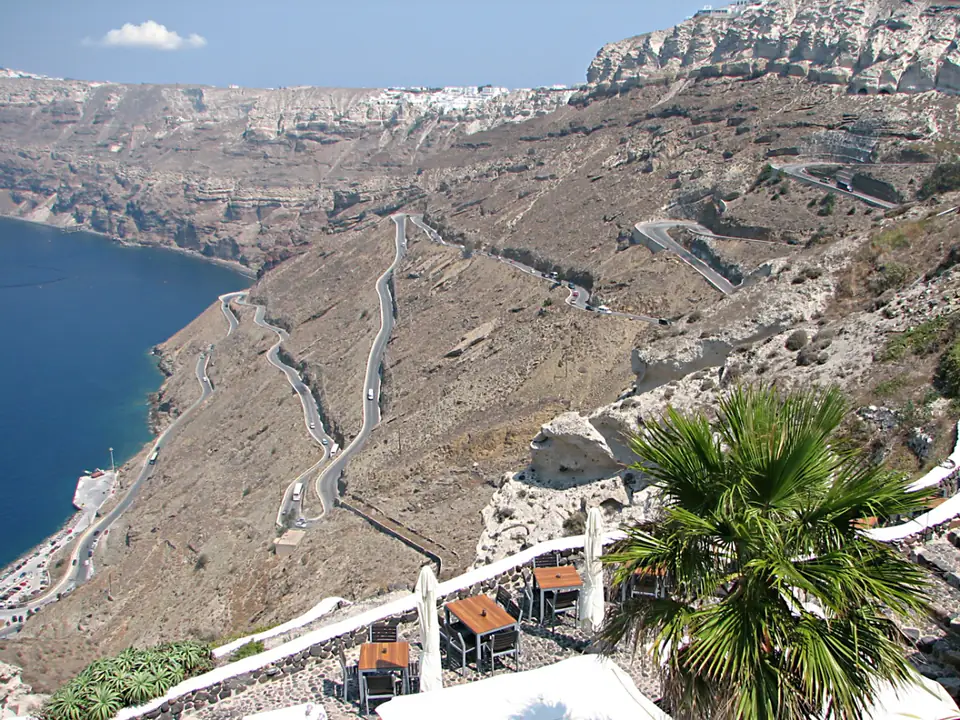 The port at the foot of the cliff, and the switchback road out of it