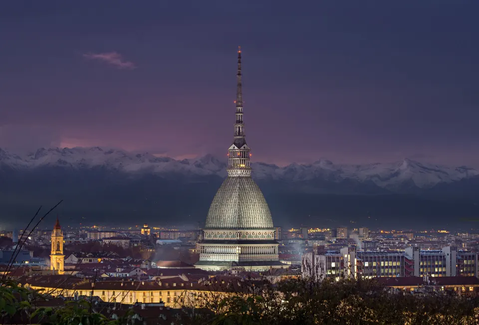 Turin at dusk, the Mole Antonelliana against the Alps