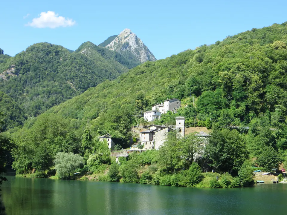 Isola Santa on its emerald reservoir