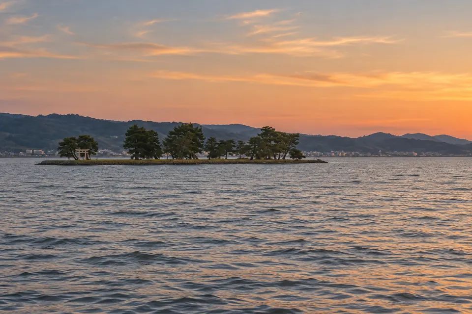 Lake Shinji at sunset with Yomegashima island