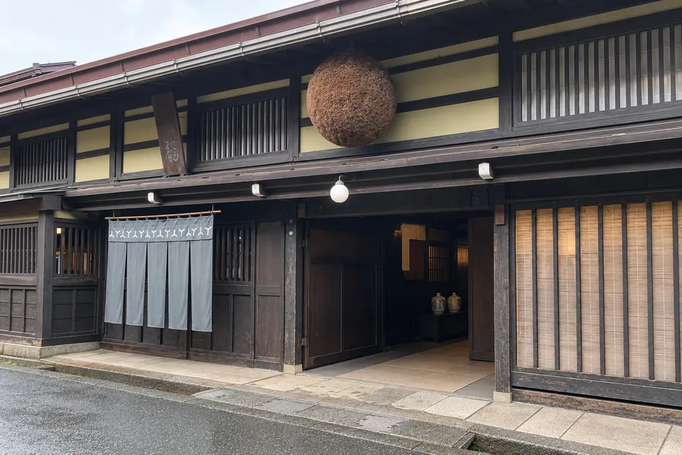 Sanmachi merchant street with a sake brewery's cedar ball