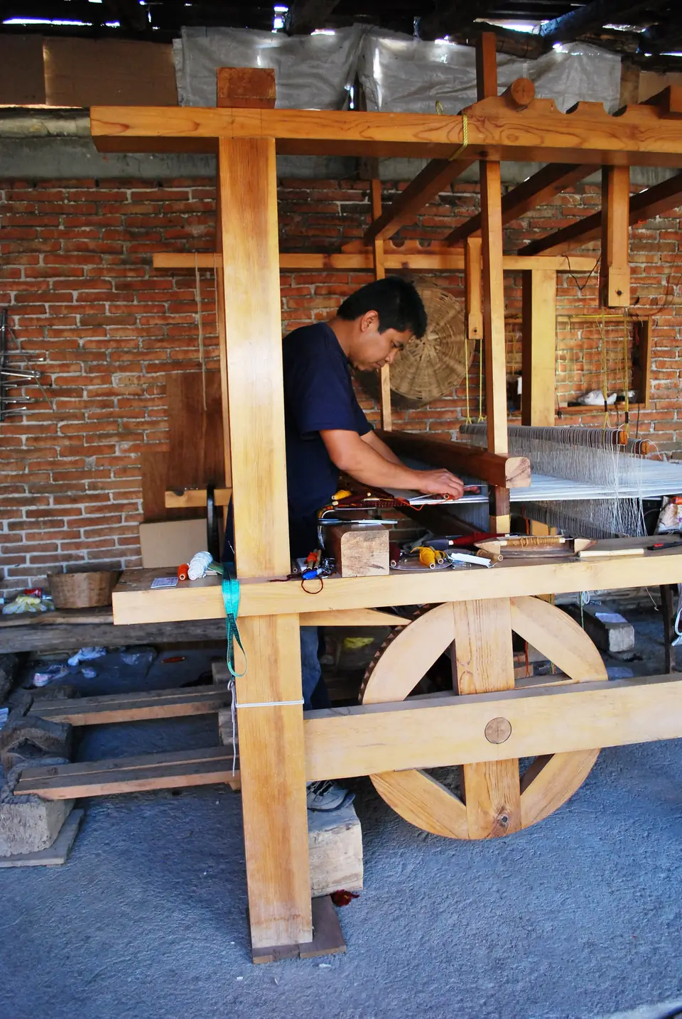 A weaver at his loom, Teotitlán del Valle