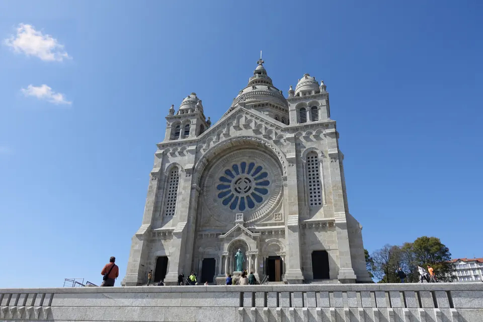 The white domes and rose windows of the Sacred Heart basilica