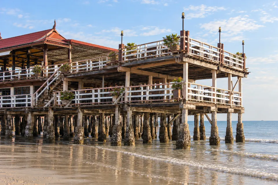 The wooden fishing pier and seafood restaurants on stilts