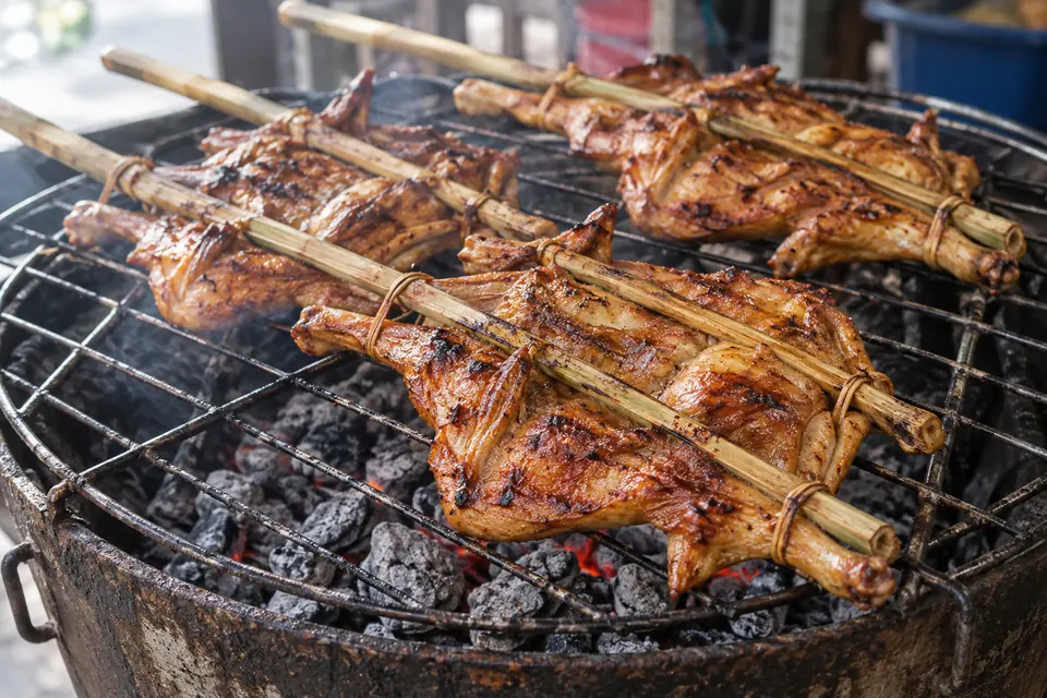 Gai yang Khao Suan Kwang, grilled chicken over charcoal