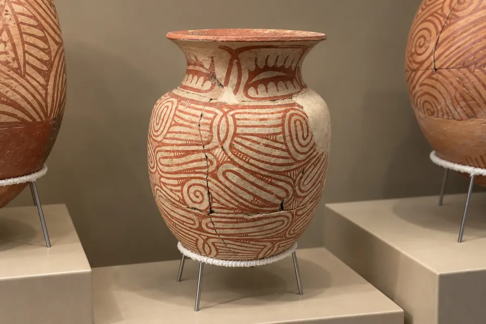 Ban Chiang painted pottery with red swirling designs