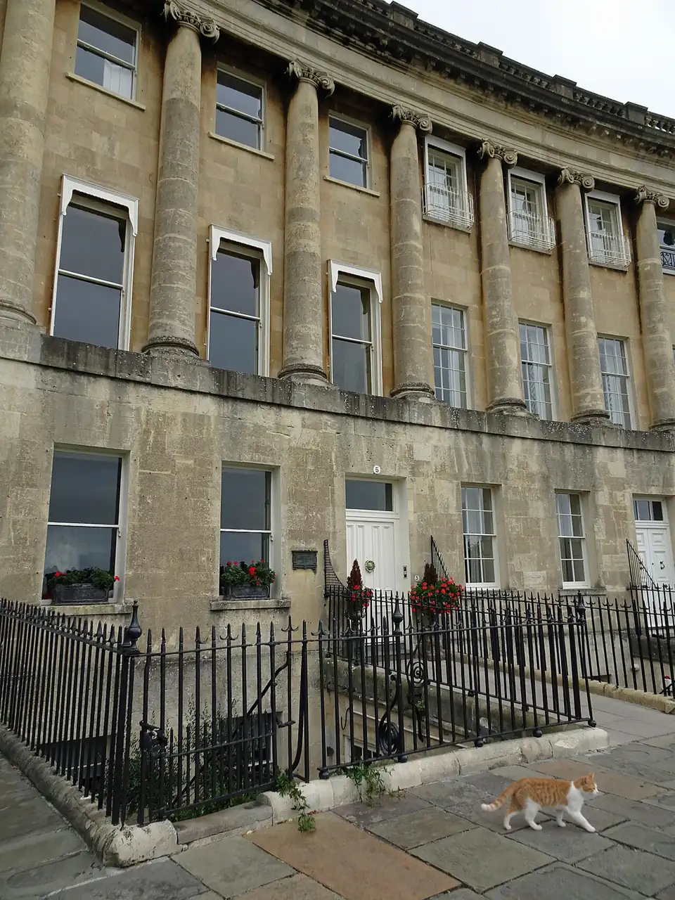 A Georgian terrace doorway in honey-colored Bath stone