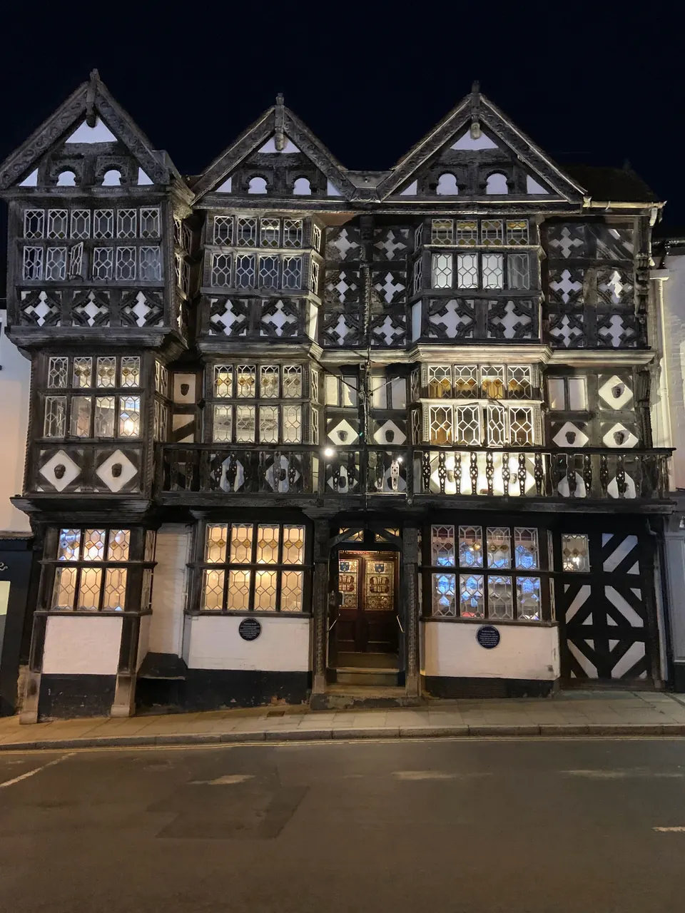 The carved timber front of the Feathers, 1619