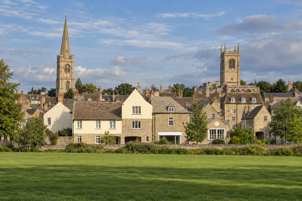The town's spires seen across the Welland meadows
